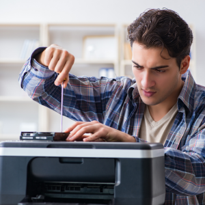 Repairman Repairing Broken Printer